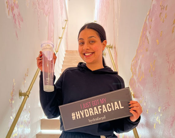 Happy client after getting hydrafacial treatment